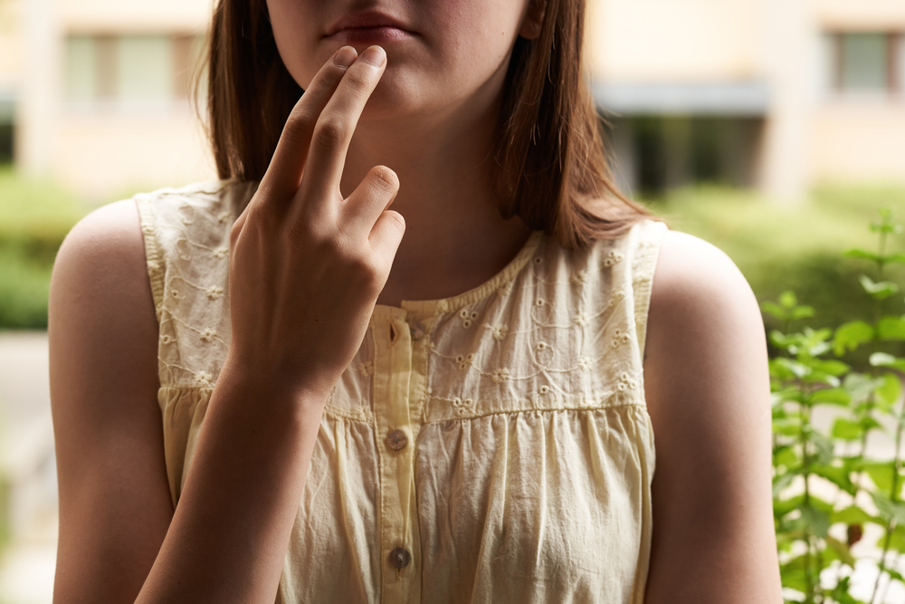 Woman practicing EFT or emotional freedom technique